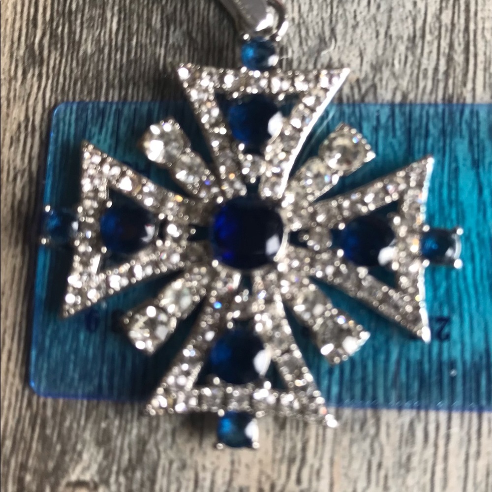Created sapphire and diamond pendant.